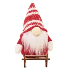 Bild på Tomte på träsläde